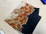 several pieces of fabric are laid out on a table next to a pair of scissors