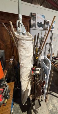a lot of tools and a bag of stuff in a room