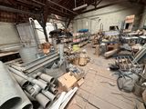 a large room full of metal pipes and other items