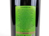 the bottle of wine is full of green liquid and has a label on it