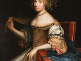 portrait of a lady seated in a red chair with a blue and white dress