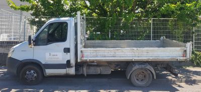 a white truck that is parked on the side of the road