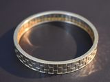 a close up of a silver ring on a table