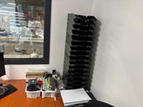 an image of a desk with a computer and a stack of books