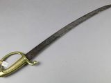 a close up of a knife on a table with a handle