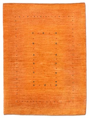 un tapis orange à petits pois sur fond blanc
