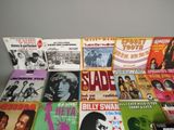 many different types of vinyl records on the table