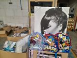 a cardboard box filled with assorted items and a picture of a woman