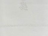 the white handkerchief has a monogramed design on it