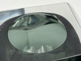 a glass bowl sitting on top of a glass table