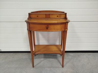 a small wooden table with a drawer underneath it