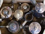 a box full of silver pots and pans in it