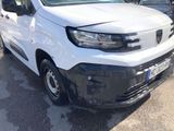 a picture of a white van parked in a parking lot