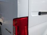 a close up of the tail light of a white van