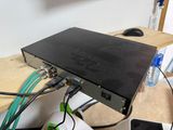 a laptop computer sitting on top of a wooden desk