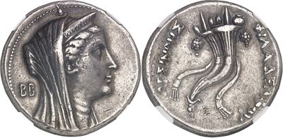 a silver coin with a woman ' s head on it