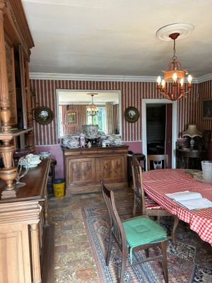 a dining room with a red and white checkered table cloth