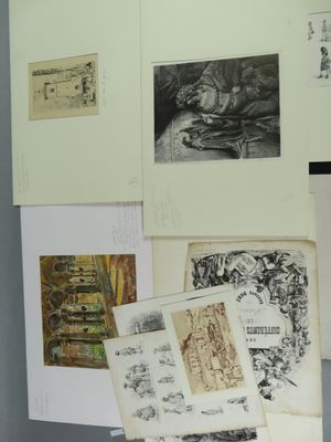 many drawings and pictures on the wall of a room