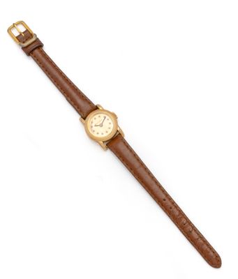 a close up of a wrist watch on a white surface