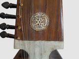 a close up of a musical instrument on a white surface