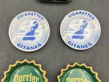 a close up of three badges on a table with a triangle