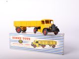 a toy truck that is sitting on top of a box
