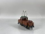 a toy train with a radio tower on top of it