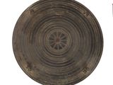 a large metal plate with a circular design on it