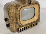 a small metal object with a television on it