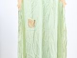 an image of a green dress hanging on a hanger