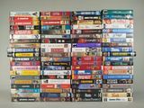 a lot of dvds stacked on top of each other