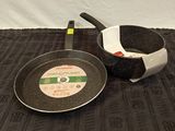 a frying pan and a frying pan on a table