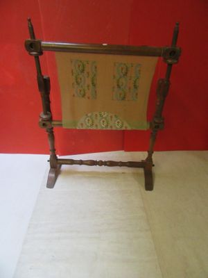 a wooden frame with a sign on it in a room