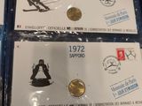 three different types of olympic coins are on display in a box