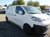 a white van that is parked in a parking lot