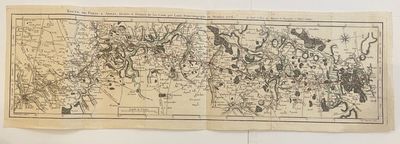 an old map of the world is hanging on a wall