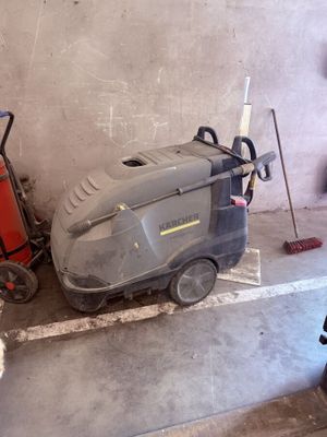 a machine that is sitting on the floor next to a fire hydrant