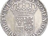 a silver coin with a crown on top of it
