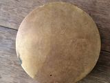 a wooden floor with a round object on it
