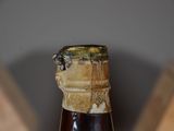 a close up of a bottle of beer on a table