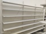 a empty shelf in a store with empty shelves