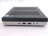 the back view of a small computer with a keyboard and mouse