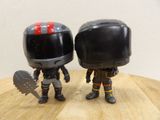 two action figures that are standing next to each other