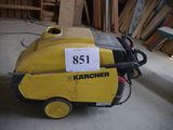 a yellow machine that is sitting on the floor