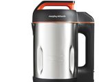 a silver and orange electric tea kettle on a white background