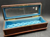 an image of a wooden box with a glass lid on a table
