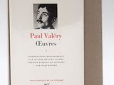 the book is opened to reveal a picture of a man with a mustache