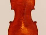 an old violin with a wooden back and a long neck