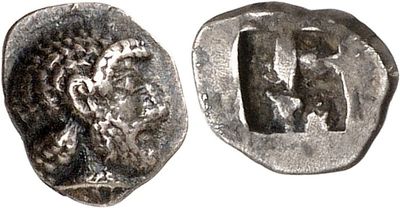a silver coin with an image of a man and a woman on it