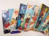 several children ' s books are lined up on a table